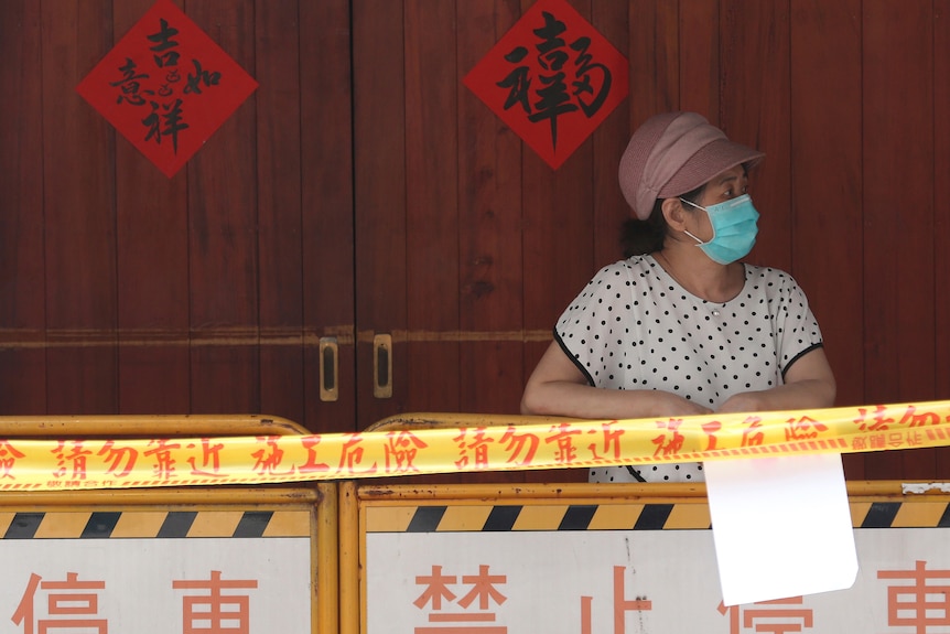A woman wearing a surgical face masks 