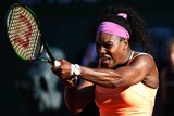 Serena Williams hits a backhand against Timea Bacsinszky