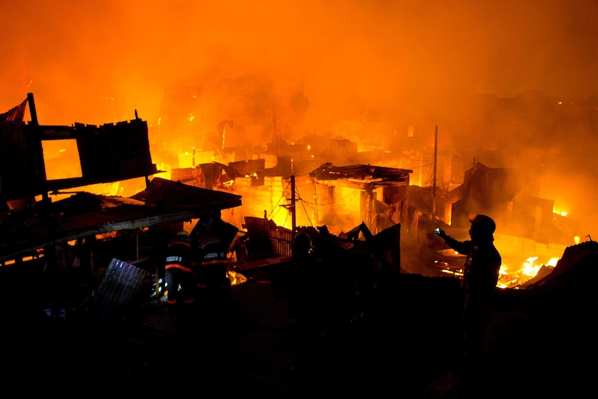 Fire burning at shanty town in the Philippines
