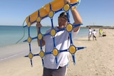 Shark barrier net held aloft on Coogee Beach