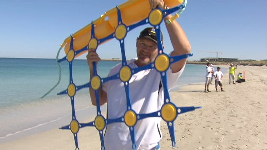 Shark barrier net held aloft on Coogee Beach