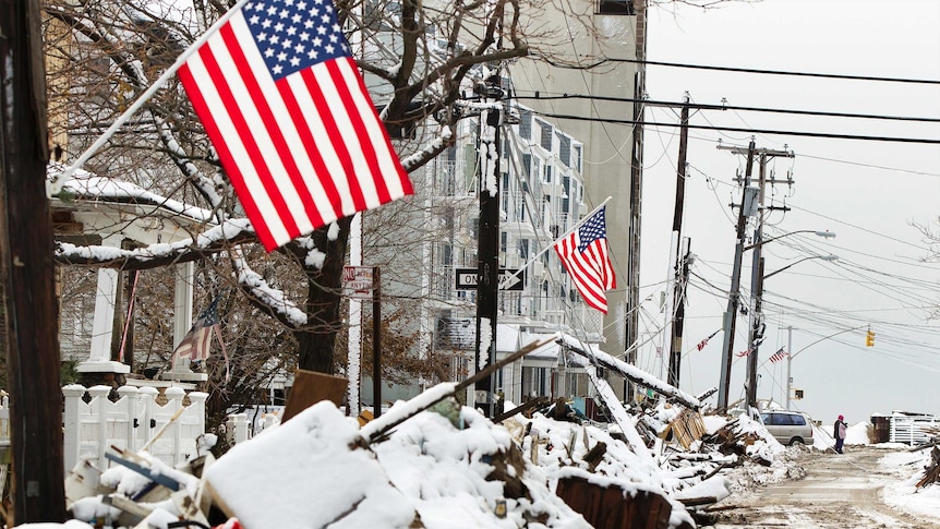 Snow-covered debris left on the street after superstorm Sandy in the Queens borough neighborhood of Rockaway Beach.