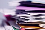 A stack of envelopes and paper pictured up close