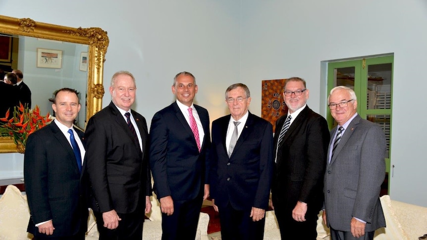 The newly sworn-in ministers pose for a photograph with Chief Minister Adam Giles and NT Administrator John Hardy.