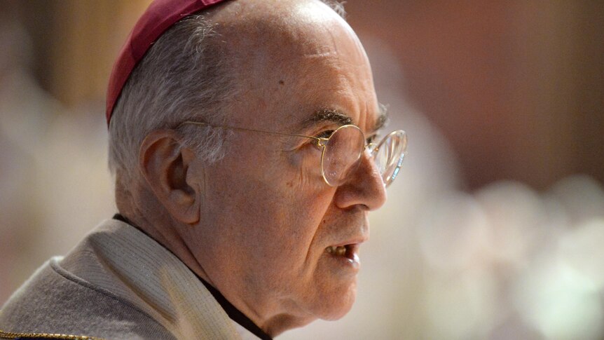 A close up image of Catholic Archbishop Vigano, an elderly man with grey hair. 