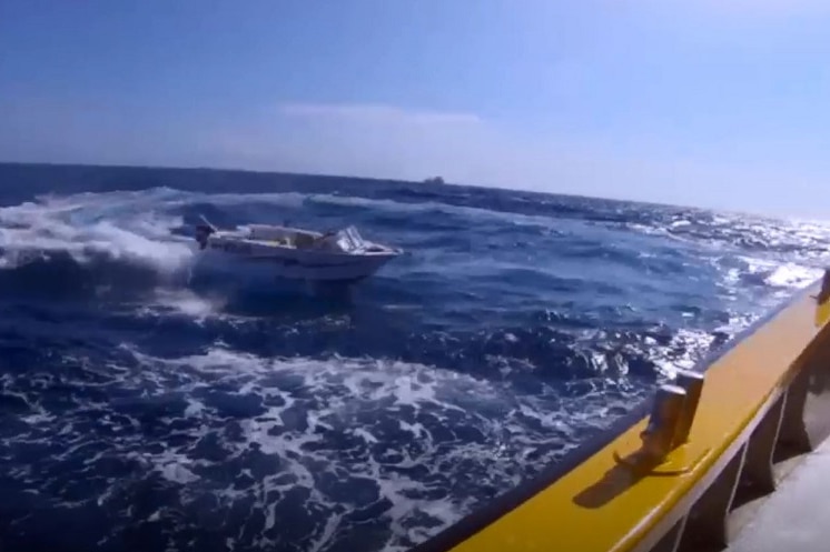 A 4.5-metre boat doing circles in the ocean