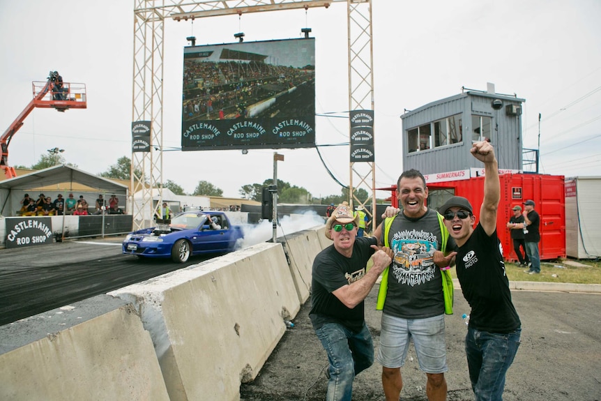 Summernats co-owner Andy Lopez, centre, with international guests.