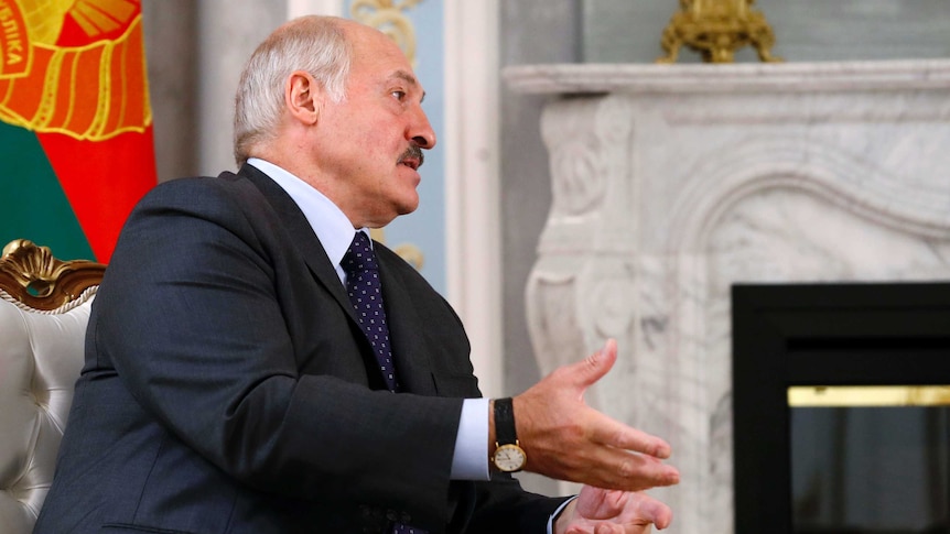 Belarusian President Alexander Lukashenko gestures as he speaks.
