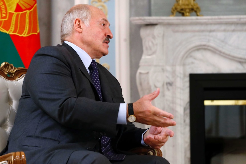 Belarusian President Alexander Lukashenko gestures as he speaks.