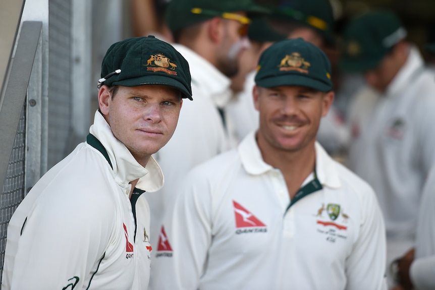 Steve Smith and David Warner look on from the sidelines