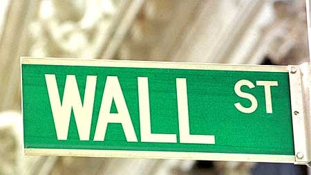 Wall Street recovered from earlier losses in volatile trade overnight.