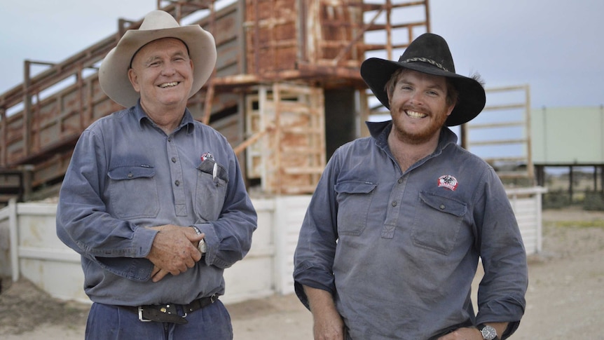 Garth and Patrick Tully standing together at the yards on Cluny station near Bedourie.