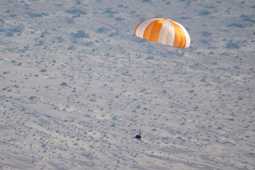 A capsule with a parachute