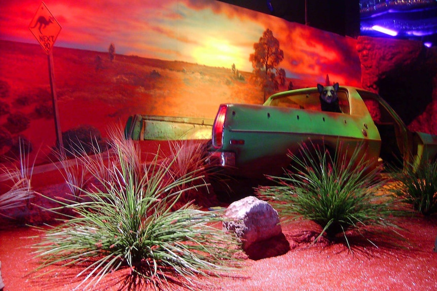 An indoor mini golf course with a parked ute and Australian outback decorations