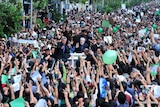 Masses mourn protesters: Opposition leader Mir Hossein Mousavi attended the rally