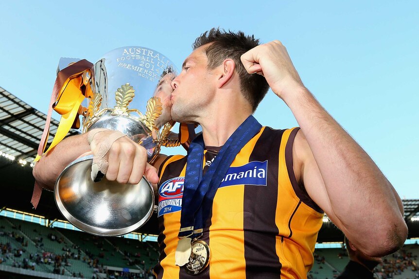 Hodge celebrates with the AFL premiership cup