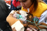 Baby pulled from quake rubble