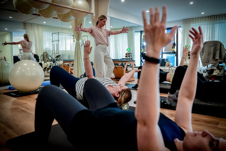 A group of women participating in a pilates session