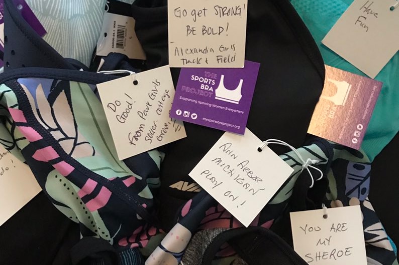Tags on bras with positive affirmations like 'be bold' and 'you are strong'.