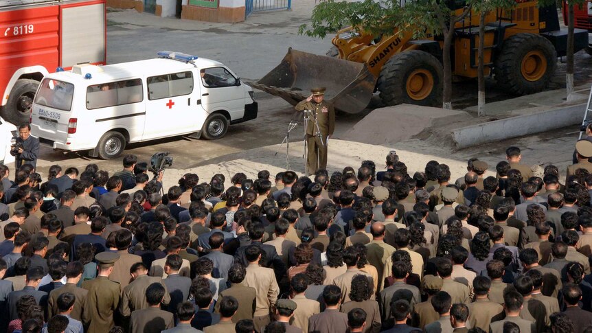A construction division officer (top) apologises to residents following the May 13 incident in Phyongchon District, Pyongyang.