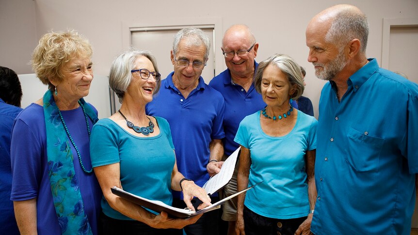 3 men and 3 women stand in a group at the local choir for a story on share housing when you're retired.