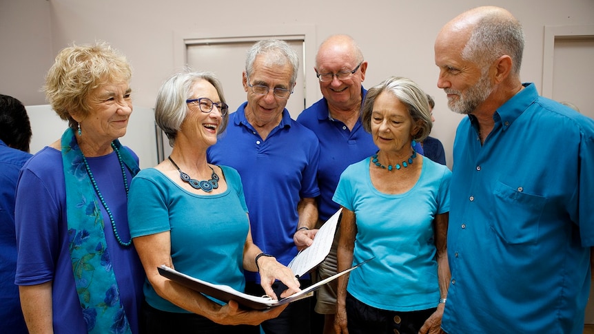 3 men and 3 women stand in a group at the local choir for a story on share housing when you're retired.