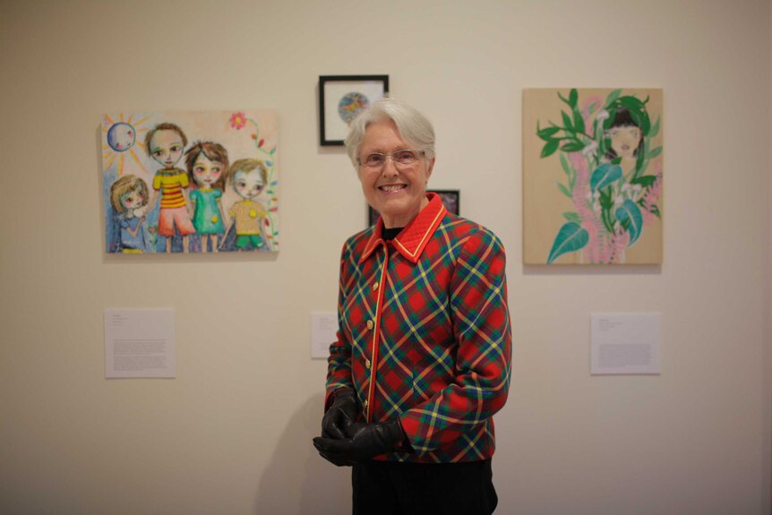 Betty Reeve in front of some of the 2017 Material Girl exhibits.