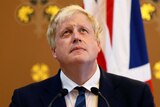 Britain's Foreign Secretary Boris Johnson looks up during a press conference.