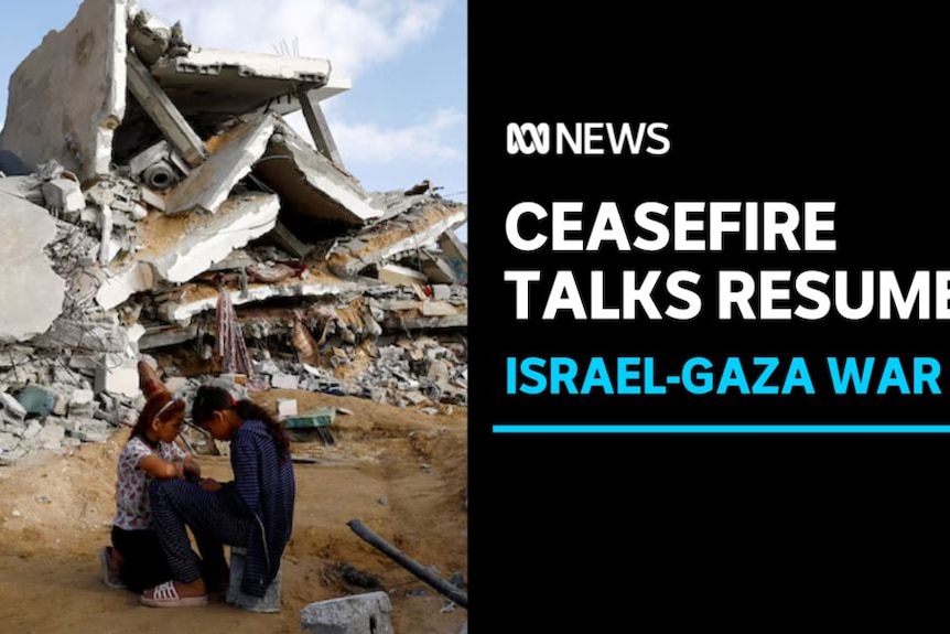 Ceasefire Talks Resume, Israel-Gaza War: A couple huddles together in front of the ruins of a building.