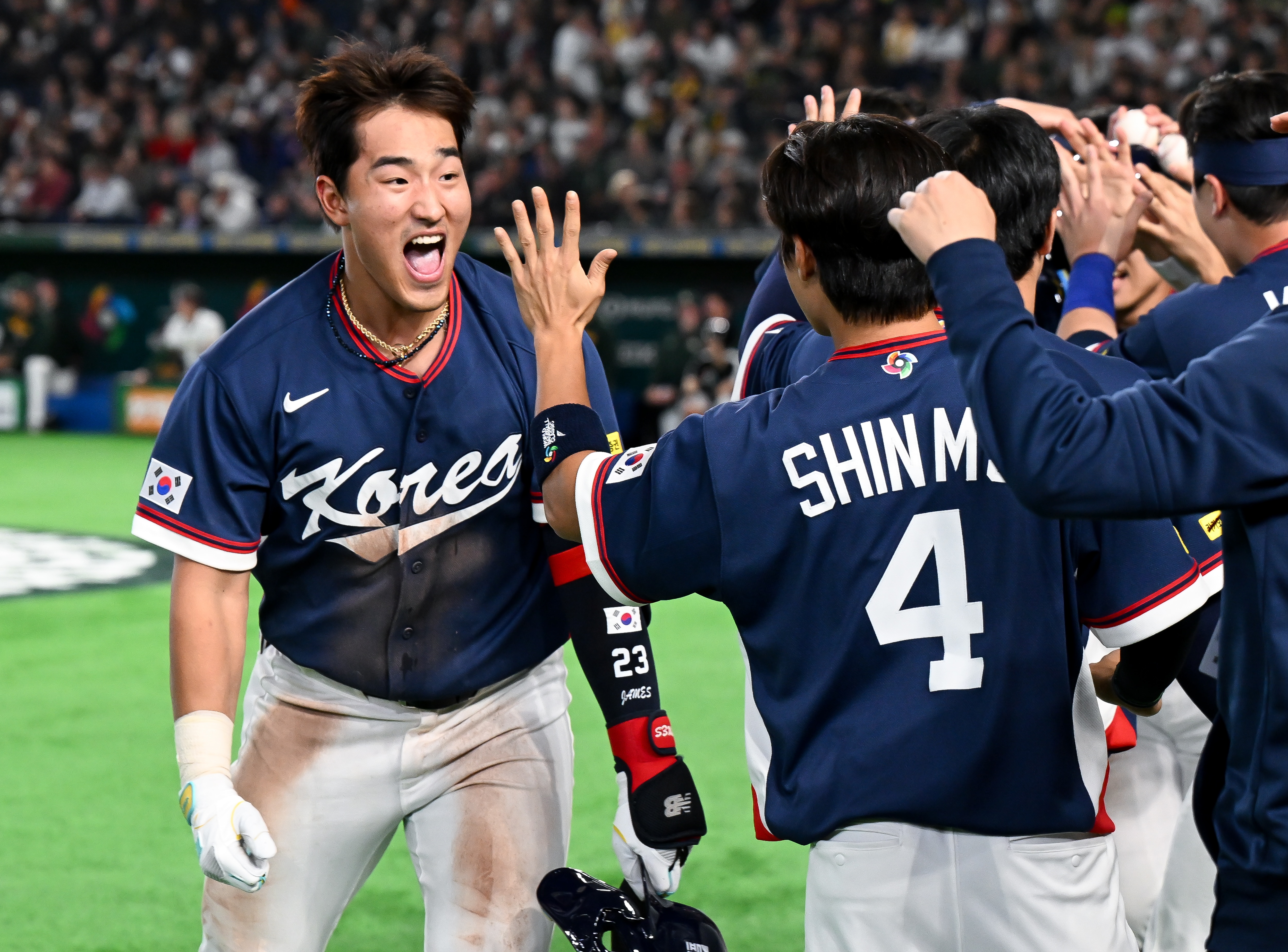 Hyun Min Ahn celebrates with his Korean teammates