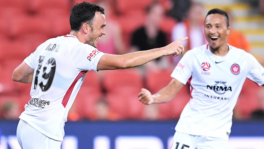 The Wanderers' Mark Bridge (L) celebrates his goal against Brisbane Roar at Lang Park.