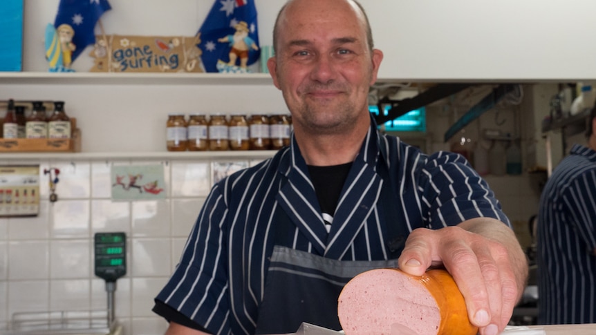 Collinswood butcher Steve Howell holds one of South Australia's iconic Bung Fritz.