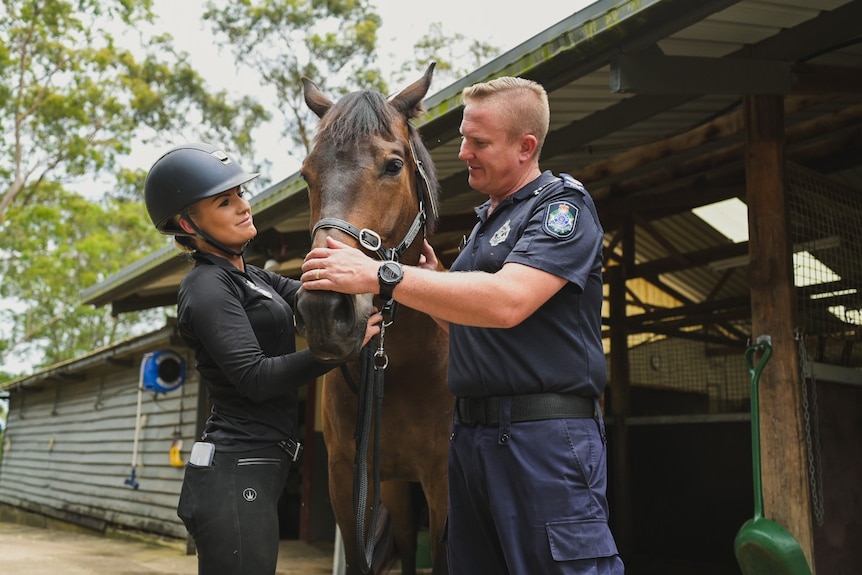QPMU Horse Manager Hannah Guise with horse Stormy and Senior Sergeant Paul Mason