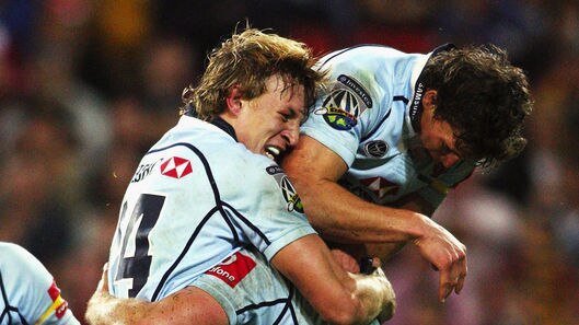 Resurgent: Dean Mumm celebrates a try for the Waratahs, who recorded their ninth victory of the season.