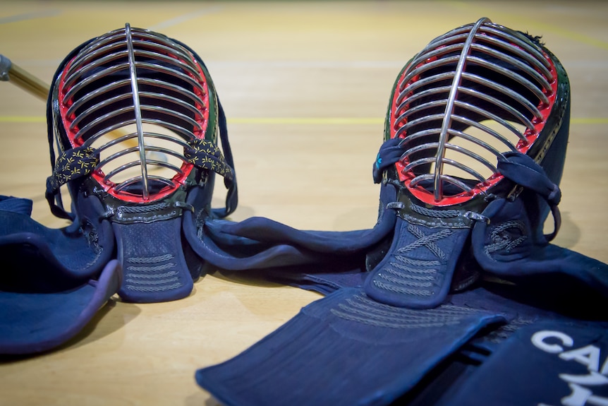 Two protective helmets worn by kendo practitioners.
