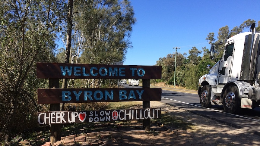 A sign advising visitors to Byron Bay to cheer up and chill out