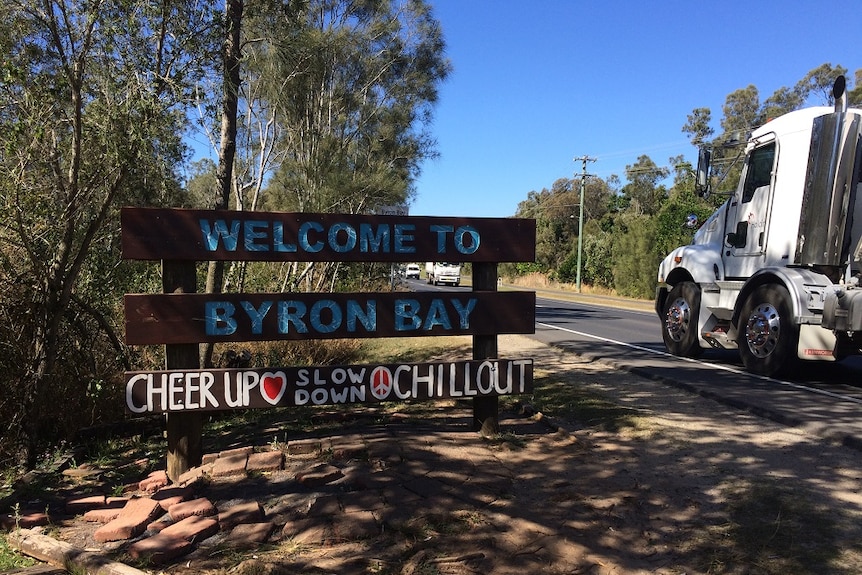 A sign advising visitors to Byron Bay to cheer up and chill out