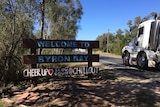 A sign advising visitors to Byron Bay to cheer up and chill out