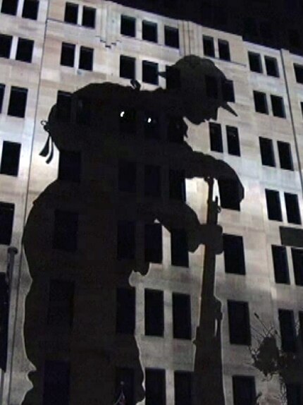 The image of a soldier is projected onto a building in Sydney's Martin Place