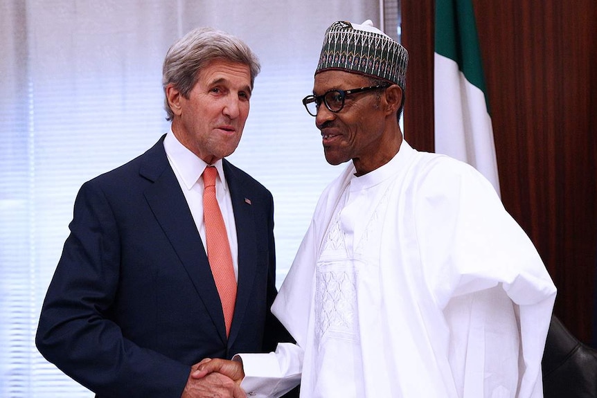 John Kerry and Muhammadu Buhari shake hands.