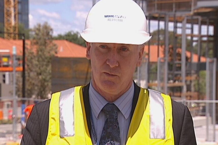 ACT Work Safety Commissioner Mark McCabe outside the Nishi apartments in Canberra's city.