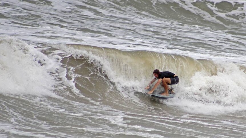 A surfer riding a wave.