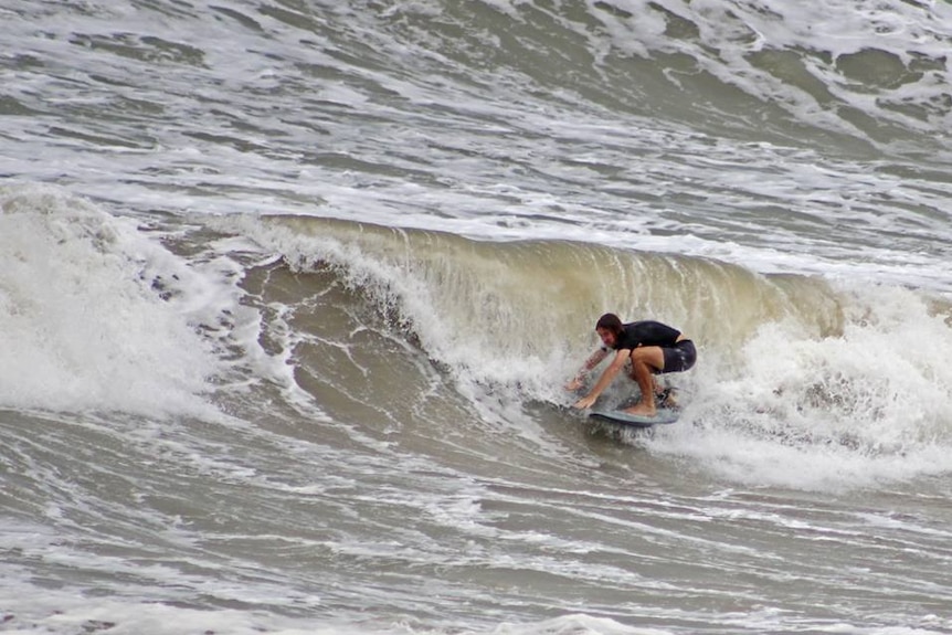 A surfer riding a wave.