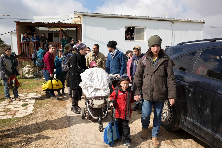 Israeli forces begin evacuating controversial settlement, Amona.