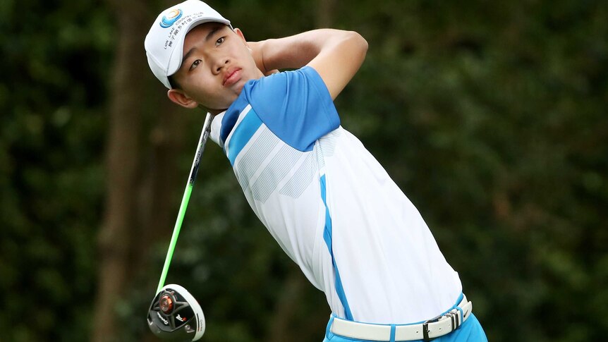 Tianlang Guan tees off on the second hole.