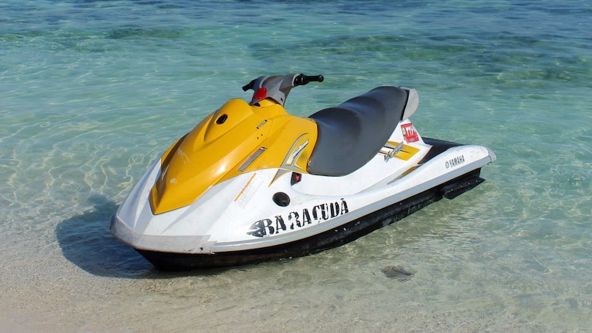 Black and yellow jet ski on the ocean