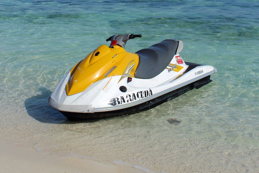 Black and yellow jet ski on the ocean