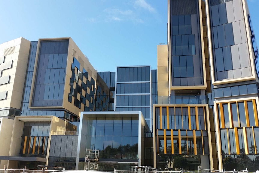 a modern building made up of several glass box like buildings joined together