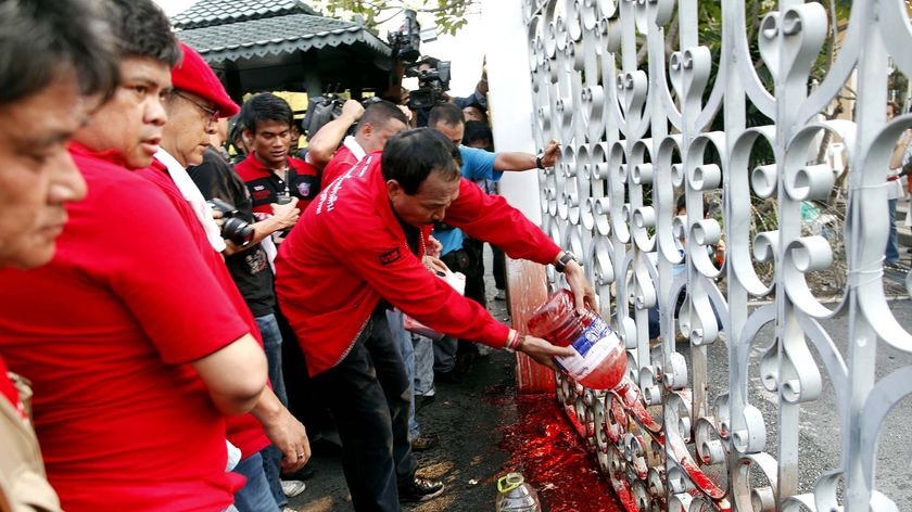 Red Shirt protesters pour human blood on gates of the Thai parliament