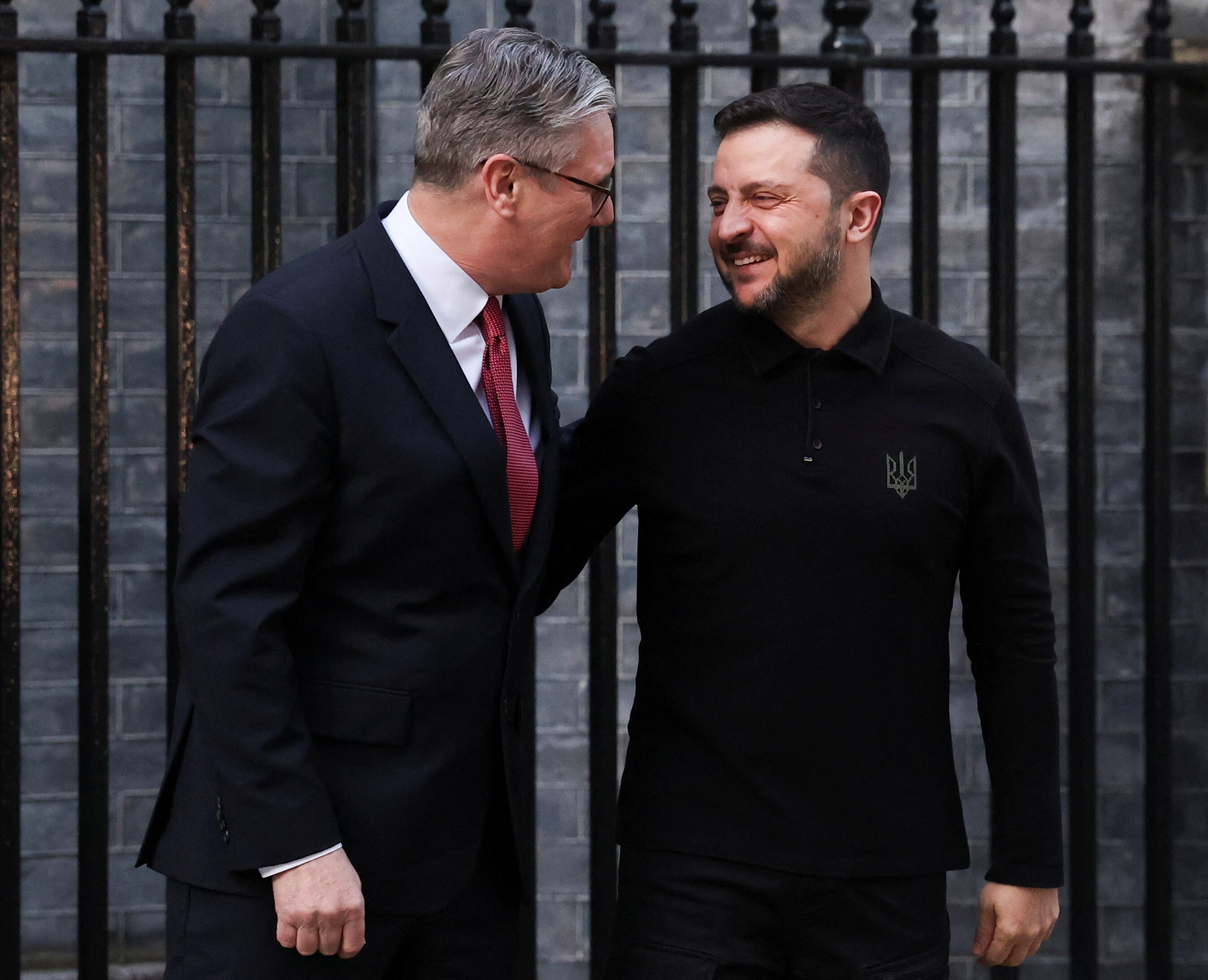 Keir Starmer smiling and standing next to Volodymyr Zelenskyy on Downing Street.